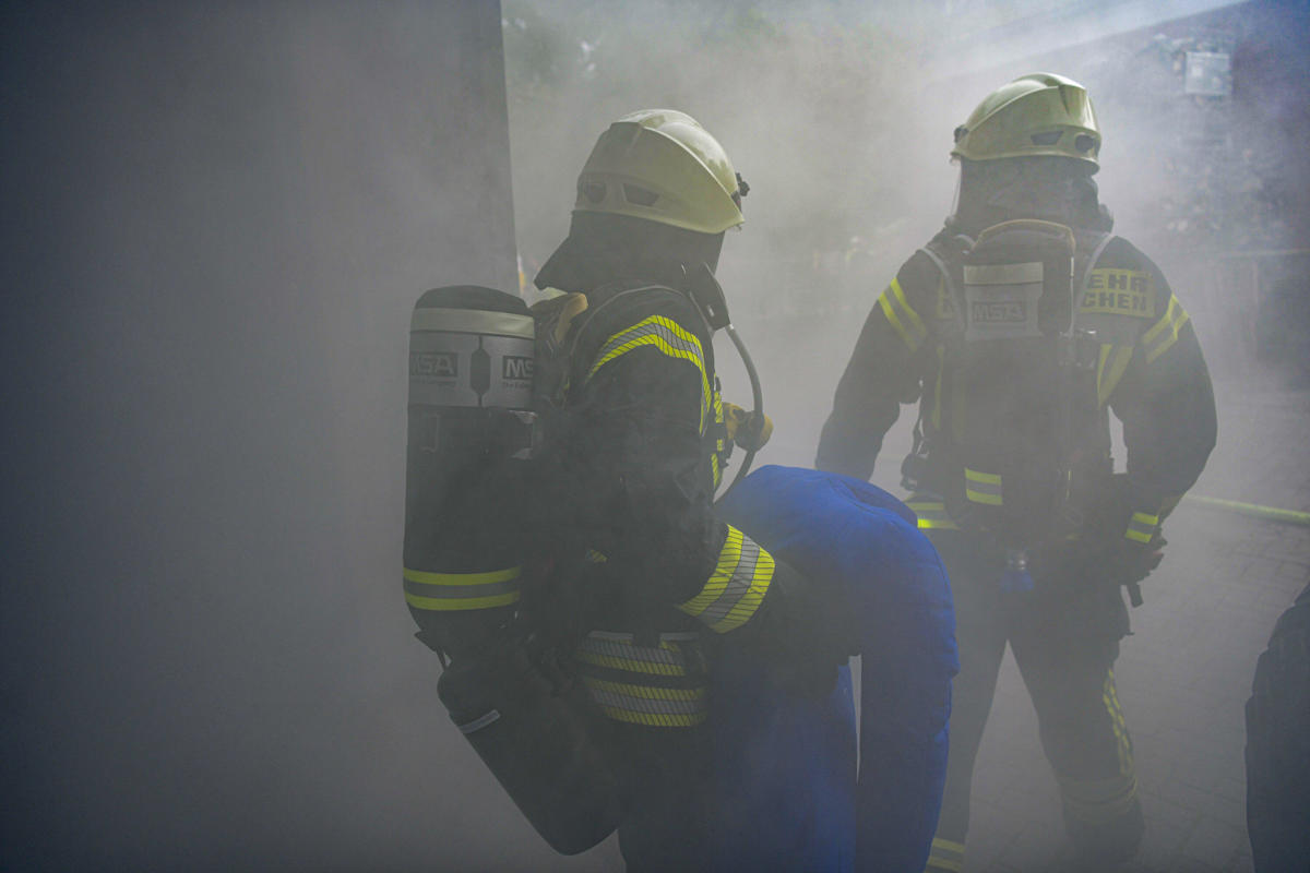 Fire department practices emergency in smoke-filled bay